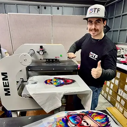 Applying DTF transfer with heat press on a t-shirt