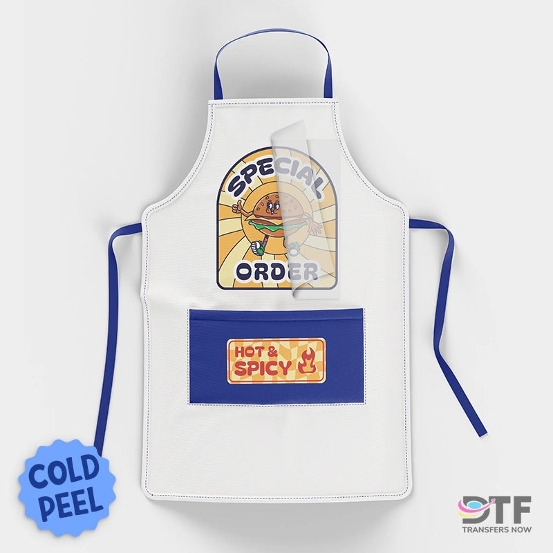 "White kitchen apron showcasing Cold Peel DTF Transfers for Custom Apparel with a vintage 'Special Order' burger character and a 'Hot & Spicy' pocket logo."