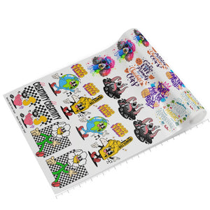 Rolled DTF Gang Sheet with multiple colorful cartoon designs.