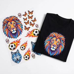 Same-day DTF gang sheet next to a folded black t-shirt with the pressed lion design