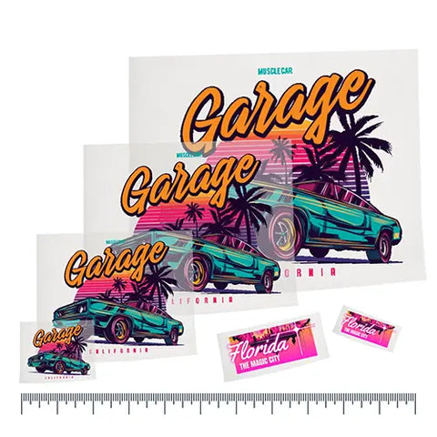 Assorted 'Garage California' retro car decals displayed over a ruler to showcase custom UV DTF transfers by size for various applications.